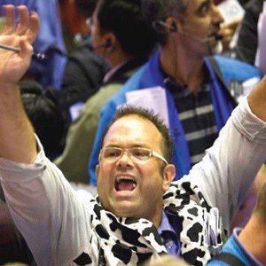Man waving arms during market bidding