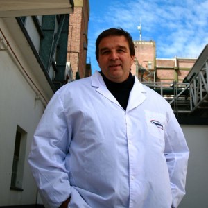 Man in white lab coat.
