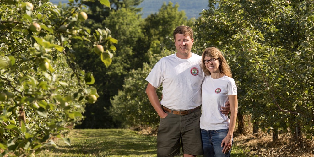 Andrew and Jennifer Lovell in their apple orchard.