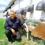 Man with agricultural seeder.