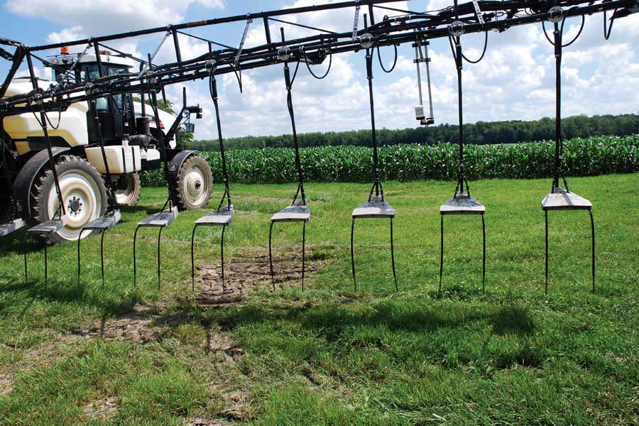Sprayer applying fertilizer to a field.