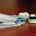 paperwork on a wooden desk