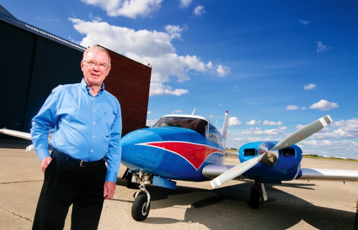 man on runway with plane