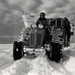 Sir Edmund Hillary on tractor at South Pole