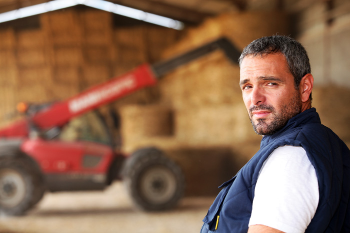 farmer in a haybarn