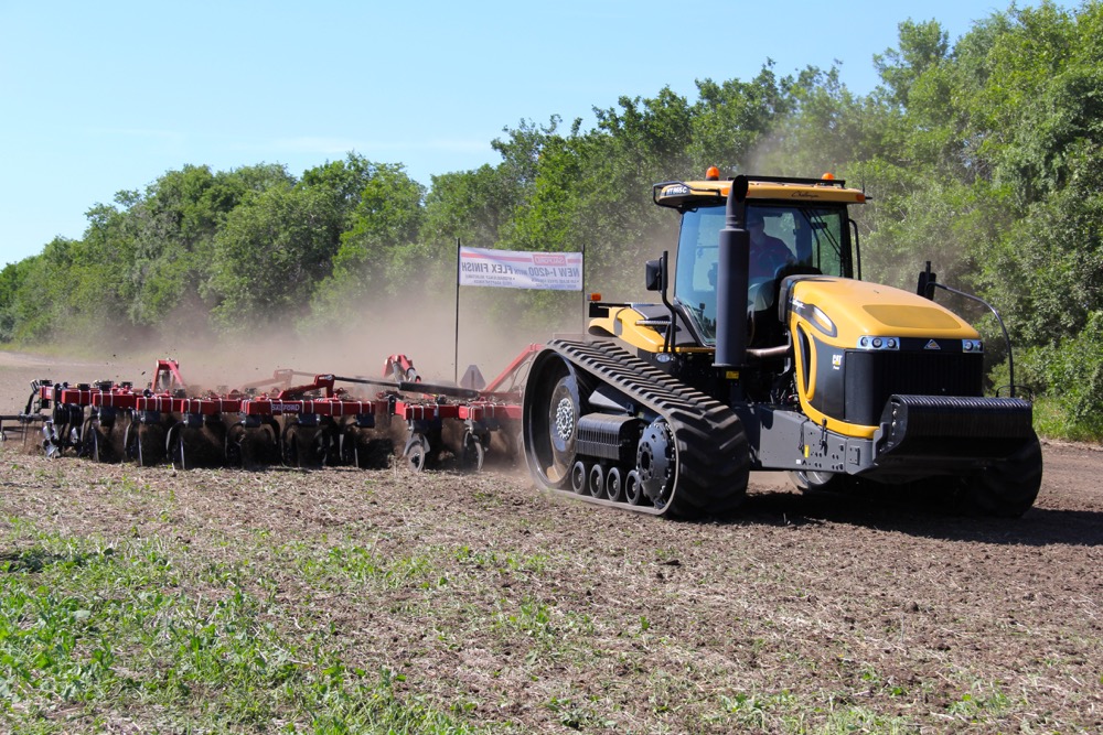 The Ontario-based Salford Equipment kicked off the field demonstrations at the first-ever Ag In Motion farm show near Saskatoon this week, showing how this 30-foot wide vertical tillage tool can be used to work in crop residue and open up the soil. Salford which had its roots in developing tillage equipment for corn and soybean production in Eastern Canada has expanded it’s machinery line over the past 10 years for Western Canadian farming conditions. Vertical tillage equipment is one of their most popular products although the company has also expanded into seeding and fertilizer application systems. With 320 acres of prairie crop land to work with, the Ag In Motion farm show was an excellent venue for many of the major tractor and field equipment manufacturers to demonstrate how their products performed in the field.