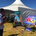 Saskatchewan farmers Henry and Aaron Van Ee take up the rain gauge challenge with water pistols at the CocoRaHs water gun booth.