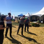 Saskatchewan farmers Henry and Aaron Van Ee take up the rain gauge challenge with water pistols at the CocoRaHs water gun booth.
