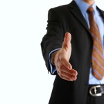 A business team shaking hands to seal a deal