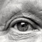 An older mans eye in black and white