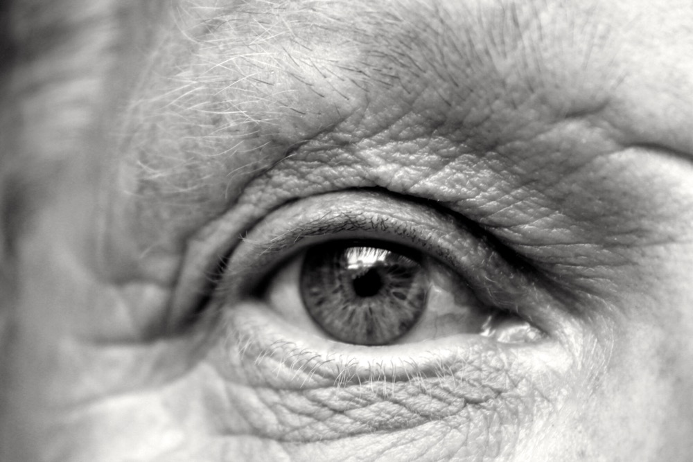 An older mans eye in black and white