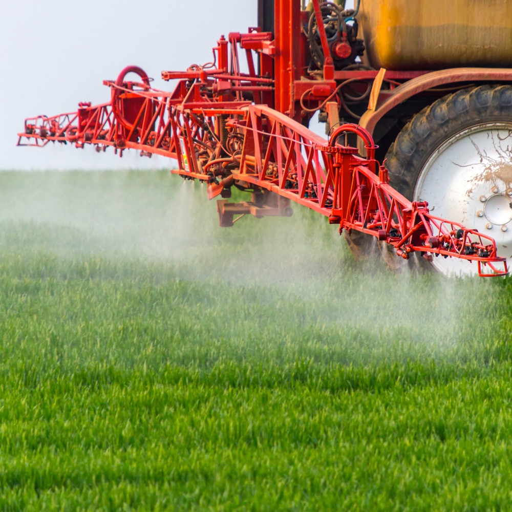 Spraying machine working on the green field