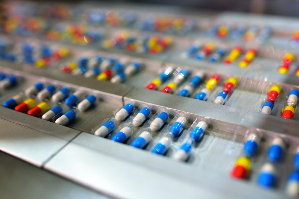Close-up of the automatic capsule package production line.