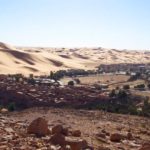Sahara sand dunes loom over the village of Taghit in western Algeria, about 300 km south of Ain Sefra where snow fell this past week. (CIA.gov)