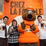 A+W — whose Root Bear mascot is shown here in March 2013, opening the chain’s 100th restaurant in Quebec — booked higher same-store sales in 2013, partly crediting its “Better Beef” campaign. (CNW Group/A+W Food Services of Canada Inc. )