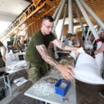 Soldiers prepare sandbags at Portage la Prairie, Man. to protect property at risk of flooding along the Assiniboine River. (Co-operator photo by Shannon VanRaes)
