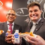 Domino’s Michael Curran (right, with DFC president Wally Smith) announces the Canadian chain’s commitment to Canadian cheese on Wednesday in Toronto. (CNW Group/Dairy Farmers of Canada)