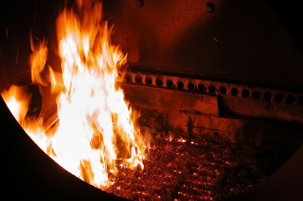 Biomass pellets burn in a boiler furnace chamber. Nova Scotia’s COMFIT program offered 17.5 cents/kWh for electricity generated from local-level biomass plants. (Matt Myers photo courtesy ARS/USDA)

