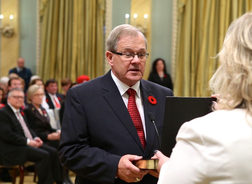 Canada’s new Agriculture and Agri-Foods Minister Lawrence MacAulay (l) is sworn-in during a ceremony at Rideau Hall in Ottawa November 4, 2015. Photo: REUTERS/Chris Wattie 
