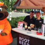 A+W CEO Paul Hollands, shown here at right during the chain’s Cruisin’ to End MS promotion in August, said the chain’s “better ingredients” campaign is still having a “powerful impact” on consumers. (CNW Group/A+W Food Services of Canada)