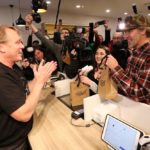 Canopy Growth CEO Bruce Linton applauds after handing Ian Power and Nikki Rose, who were first in line to purchase the first legal recreational marijuana after midnight, their purchases at a Tweed retail store in St John’s, N.L. on Oct. 17, 2018. (Photo: Reuters/Chris Wattie)