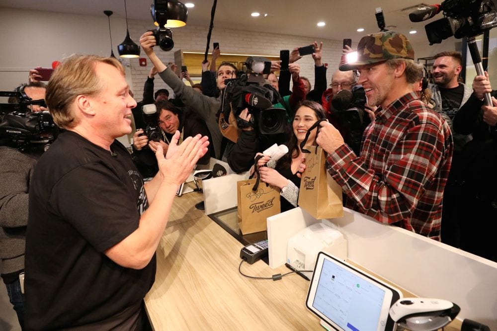 Canopy Growth CEO Bruce Linton applauds after handing Ian Power and Nikki Rose, who were first in line to purchase the first legal recreational marijuana after midnight, their purchases at a Tweed retail store in St John’s, N.L. on Oct. 17, 2018. (Photo: Reuters/Chris Wattie)
