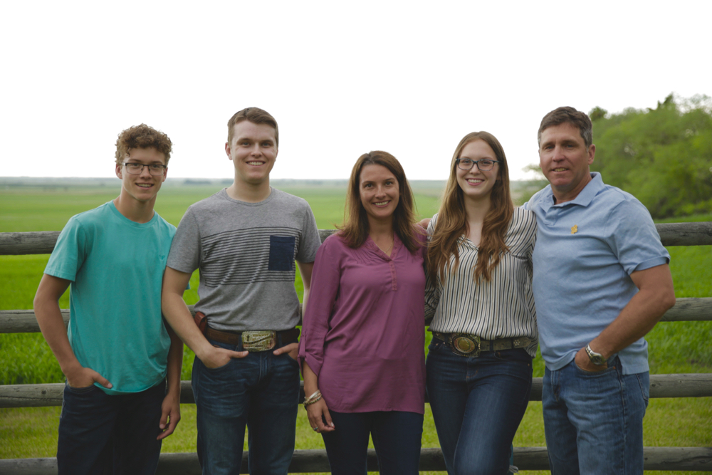 Tara Sawyer, centre, with husband Matt, right, and from left, Quin, Emmett and Cassidy.