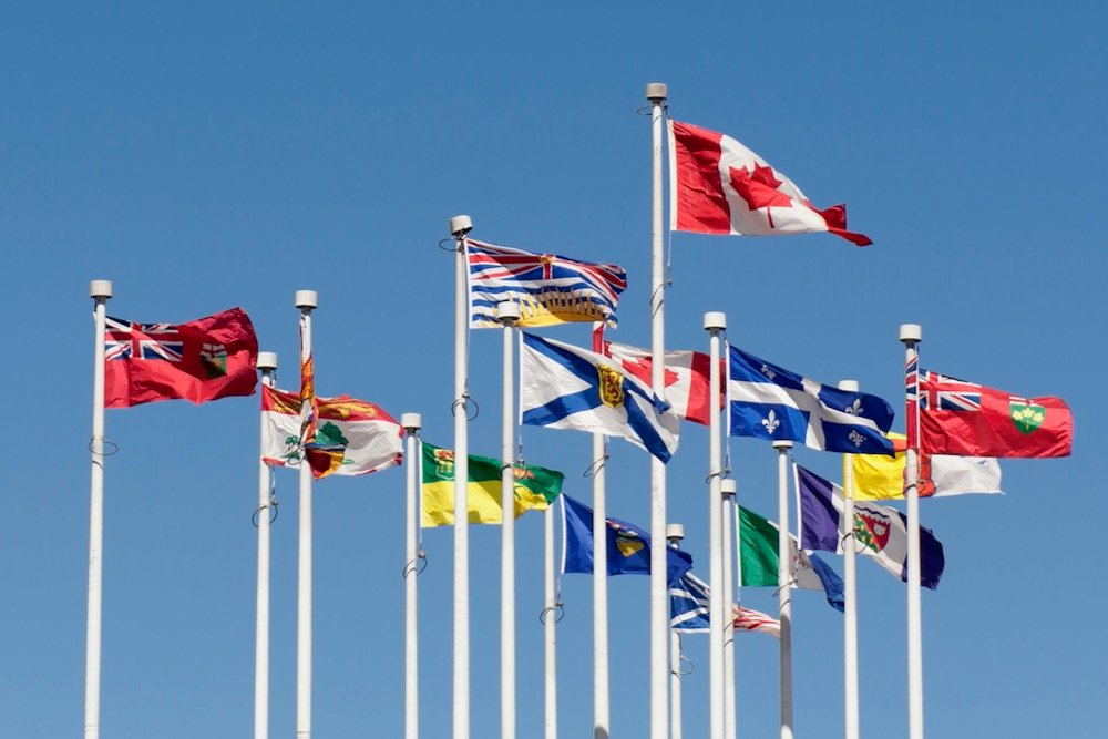 File photo of the flags of Canada and its provinces and territories at Canada Place in Vancouver. (lilly3/iStock/Getty Images)
