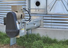 Rick Baldwin of 4 Pecks Grain Storage and Handling says coring a bin can help prevent plugging of the centre sump. Should it happen, one way of getting it moving is to cut a hole in the door and try to get a tube in as far as you can and then insert a grain vac hose.