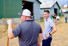 Andre Fortin, shown here at right in September at a community fair at Shawville, Que., about 75 km northwest of Ottawa, is the Quebec Liberals’ new critic for agriculture and health. (Andre Fortin via Facebook)