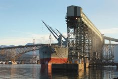 A freighter is loaded with grain from a terminal at Vancouver’s Burrard Inlet. (Maxvis/iStock/Getty Images)