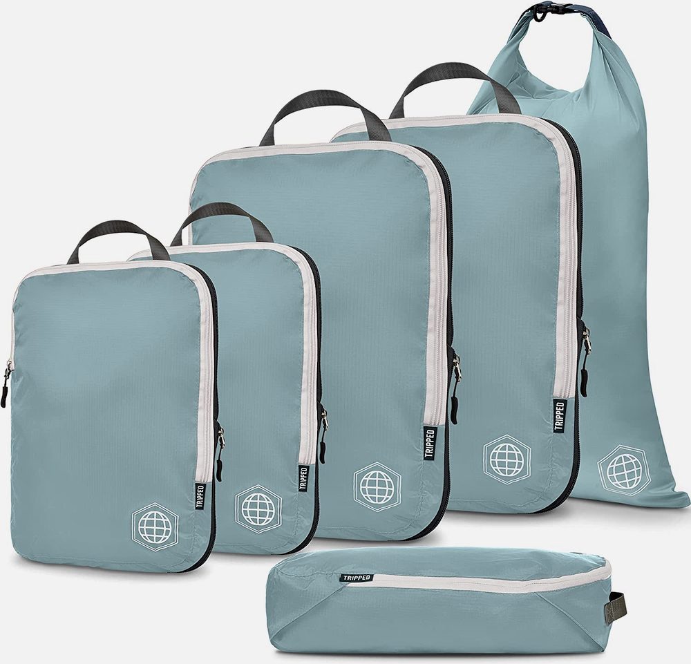 This set of six Tripped compressible packing cubes makes magic of maximizing packing space. After packing items in the zippered compartment, a second zipper compresses the entire cube down. Rolling clothes into these cubes is a game changer and will keep you organized even at your destination. $65