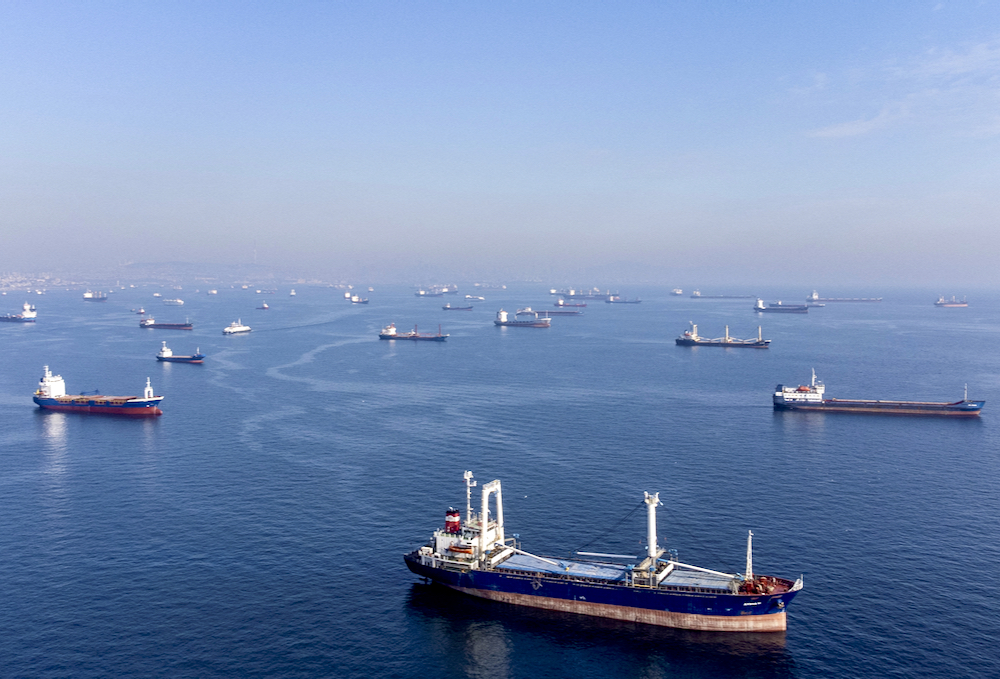 Commercial vessels  –including vessels which are part of the Black Sea grain deal — wait to pass the Bosphorus strait off the shores of Yenikapi during a misty morning in Istanbul, Turkey on Oct. 31, 2022. (Photo: Reuters/Umit Bektas)
