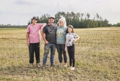 Kelly and Christi Friesen (center) and their children at Rebellion Farms in the Peace region of Alberta.