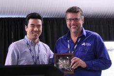 Darren Wolchyn (at right), founder and CEO of Smart Paddock, receives the Innovation Award from Kevin Chung, director of innovation investments and programs at Innovation Saskatchewan, at the Canadian Animal Ag Tech Awards. (Lisa Guenther photo)