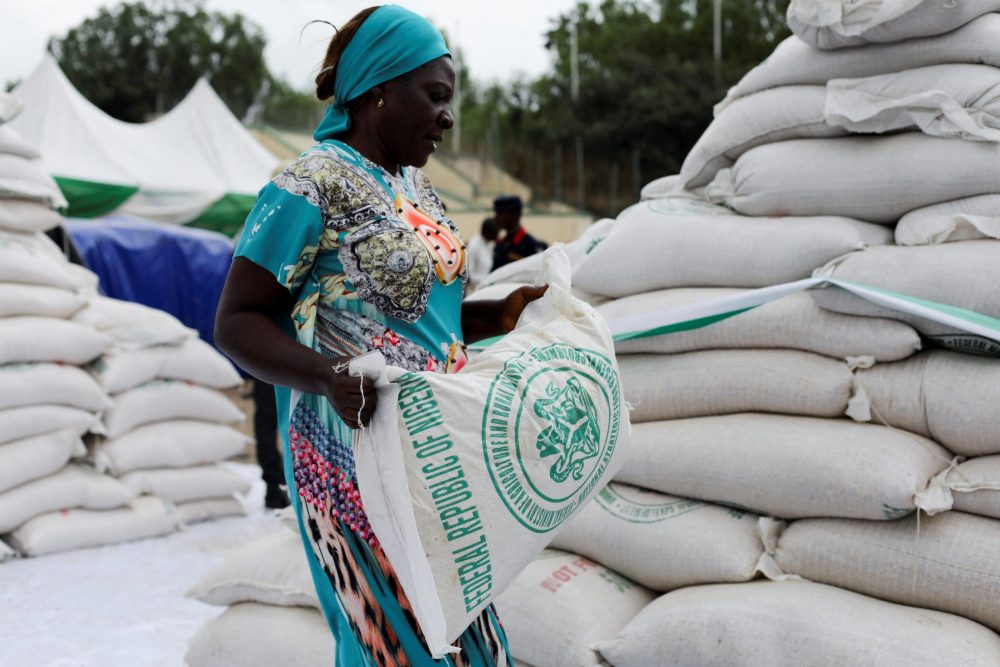 FILE PHOTO. A woman receives a bag of food from the government during the distribution of food items by the government to cushion the high cost of living in Abuja, Nigeria, September 20, 2022. REUTERS/Afolabi Sotunde
