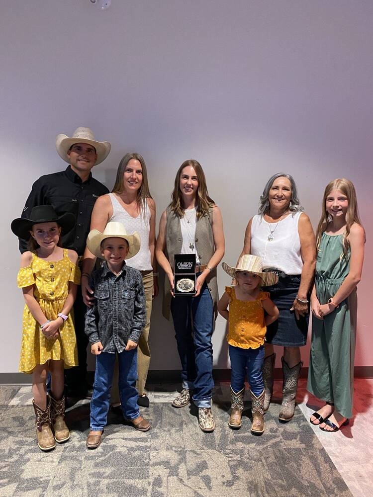 Cassie Marchand (centre) poses with the Schellenberg family, including Reg’s son Coy, daughter-in-law Laura-Lie, wife Shannon and grandchildren Ella, Nora, Ty and Faye. Photo: Canadian Cattle Association
