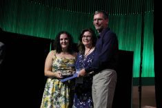Cutline: John Duynisveld and his wife, Jane, accept the TESA from Kelleen Tait. Photo: Melissa Jeffers-Bezan