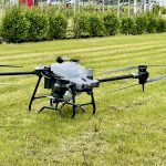 A spray drone used water to demonstrate the potential of the technology during a Manitoba crop tour this summer.