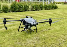 A spray drone used water to demonstrate the potential of the technology during a Manitoba crop tour this summer.