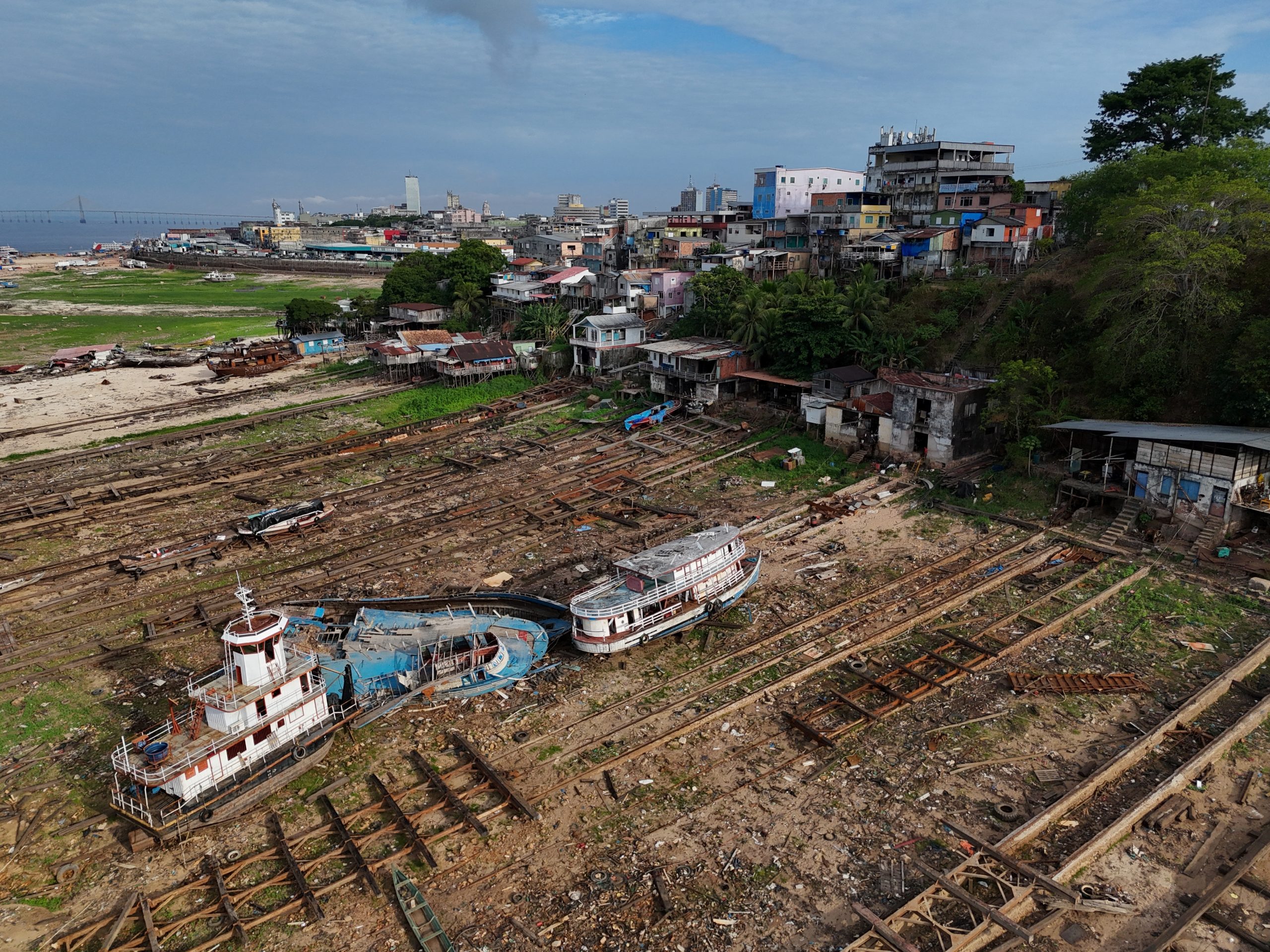 A drone view shows boats stranded on the Rio Negro as the river reached its lowest point in its history during the most intense and widespread drought the country has experienced since records began in 1950, in Manaus, Amazonas state, Brazil October 4, 2024. REUTERS/Bruno Kelly
