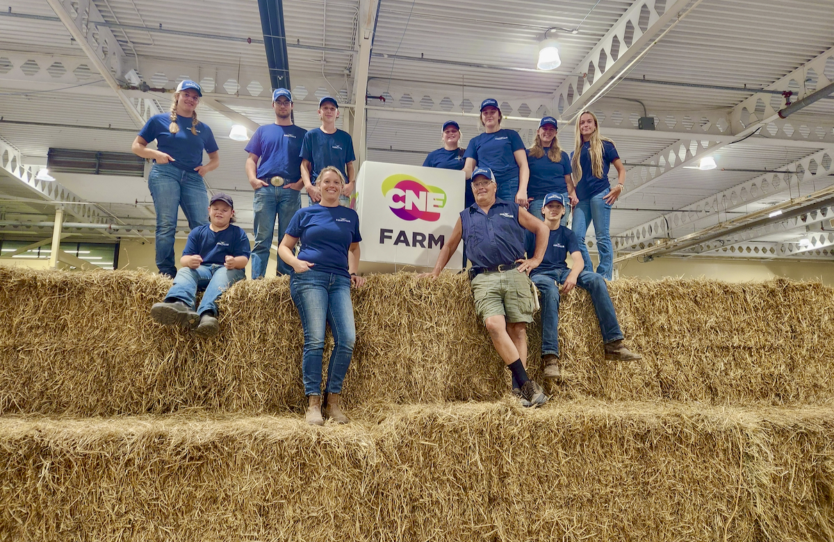 Jeanine Moyer and Allan Wallace surrounded by 2024 Farm team members, speaking up for agriculture.