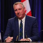 Greg Morrow signs his oath of office at a swearing-in ceremony Dec. 12, 2024 in Halifax. (Communications Nova Scotia)