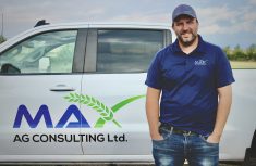 Mike Palmier standing beside a white truck