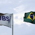 The flags of JBS S.A., the world&#8217;s largest beef producer, and the Brazil&#8217;s flag fly at a plant of JBS, in Santa Maria das Barreiras, Para state, Brazil September 12, 2025. Photo: REUTERS/Amanda Perobelli
