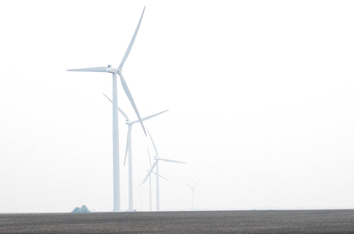 Windmills in central Manitoba disappear into heavy smoke June 9, 2025. Wildfires in Manitoba and across Western Canada led to widespread air quality warnings through May and June 2025. Photo: Alexis Stockford
