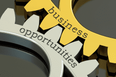 two gears intertwined, one says business, one says opportunities