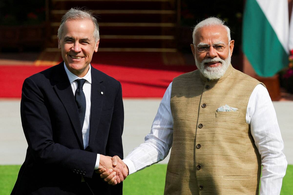 Canada’s Prime Minister Mark Carney walks with his Indian counterpart, Narendra Modi, before their meeting at Hyderabad House in New Delhi, India, March 2, 2026. Photo: REUTERS/Adnan Abidi
