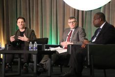 (Left to right) Jeff Mahon, Greg MacDonald and Edwini Kessie speak on a panel at the Canadian Crops Convention in Toronto on March 12. Photo: Jonah Grignon
